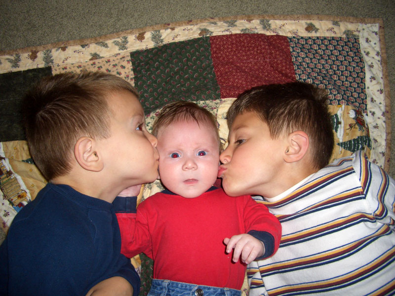 boys_laying_down_kiss.jpg